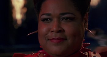 Movie still from “Super Mario Bros.” (1993), directed by Annabel Jankel – A person with a red shirt; Close Up shot, Low angle