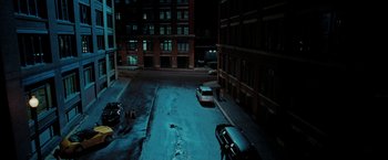 Movie still from “Surrogates” (2009), directed by Jonathan Mostow – A parking lot at night with cars parked on it; Extreme Wide shot, High angle