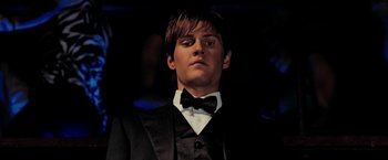 Movie still from “Surrogates” (2009), directed by Jonathan Mostow – A man in a suit and bow tie; Close Up shot, Low angle