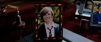 Movie still from “Surrogates” (2009), directed by Jonathan Mostow – A picture of a young man wearing a suit and tie; Close Up shot, High angle