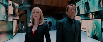 Movie still from “Surrogates” (2009), directed by Jonathan Mostow – A man and a woman walking in front of a building; Medium shot, Low angle