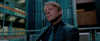 Movie still from “Surrogates” (2009), directed by Jonathan Mostow – A person wearing a suit and tie; Close Up shot, Low angle