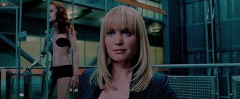 Movie still from “Surrogates” (2009), directed by Jonathan Mostow – A person with blond hair and blue eyes; Close Up shot, Over the shoulder angle