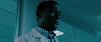 Movie still from “Surrogates” (2009), directed by Jonathan Mostow – A person wearing a lab coat; Close Up shot, Low angle