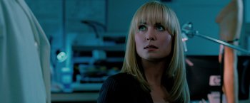 Movie still from “Surrogates” (2009), directed by Jonathan Mostow – A person with long blonde hair; Close Up shot, Over the shoulder angle