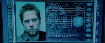 Movie still from “Surrogates” (2009), directed by Jonathan Mostow – A picture of a man's face and a computer screen; Close Up shot, Low angle