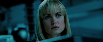 Movie still from “Surrogates” (2009), directed by Jonathan Mostow – A person with blond hair and blue eyes; Close Up shot, Over the shoulder angle
