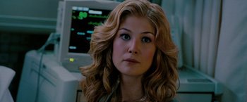 Movie still from “Surrogates” (2009), directed by Jonathan Mostow – A person with long blonde hair; Close Up shot, Over the shoulder angle