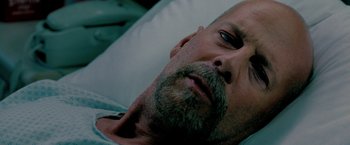 Movie still from “Surrogates” (2009), directed by Jonathan Mostow – A person laying in a hospital bed; Close Up shot, High angle