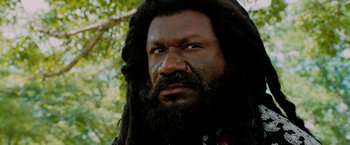 Movie still from “Surrogates” (2009), directed by Jonathan Mostow – A person with a long beard; Close Up shot, Low angle