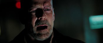 Movie still from “Surrogates” (2009), directed by Jonathan Mostow – A person with a bruised eye; Close Up shot, Over the shoulder angle