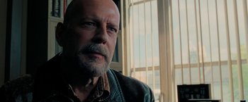 Movie still from “Surrogates” (2009), directed by Jonathan Mostow – An older man with a beard and a mustache; Close Up shot, Low angle