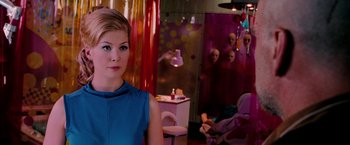 Movie still from “Surrogates” (2009), directed by Jonathan Mostow – A woman in a blue dress in a room; Close Up shot, Over the shoulder angle