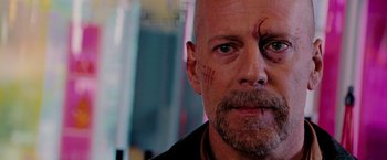 Movie still from “Surrogates” (2009), directed by Jonathan Mostow – A person with a scar on his face; Close Up shot, Over the shoulder angle