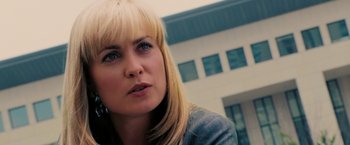 Movie still from “Surrogates” (2009), directed by Jonathan Mostow – A person with blond hair and blue eyes; Close Up shot, Over the shoulder angle
