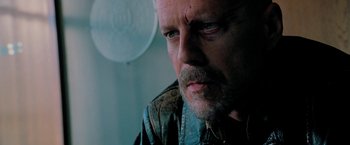 Movie still from “Surrogates” (2009), directed by Jonathan Mostow – A person wearing a jacket; Close Up shot, Low angle