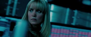 Movie still from “Surrogates” (2009), directed by Jonathan Mostow – A person with long blonde hair; Close Up shot, Over the shoulder angle