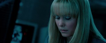 Movie still from “Surrogates” (2009), directed by Jonathan Mostow – A person with long blonde hair; Close Up shot, High angle