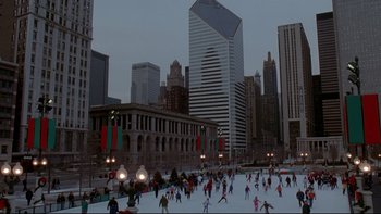 Movie still from “Surviving Christmas” (2004), directed by Mike Mitchell – People skating on the ice in a city park; Extreme Wide shot, High angle