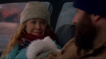 Movie still from “Surviving Christmas” (2004), directed by Mike Mitchell – A man and a woman sitting in the back of a car; Medium shot, Over the shoulder angle