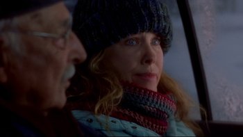 Movie still from “Surviving Christmas” (2004), directed by Mike Mitchell – A person wearing a hat and a scarf; Close Up shot, Over the shoulder angle