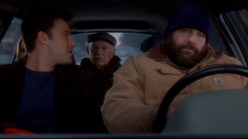 Movie still from “Surviving Christmas” (2004), directed by Mike Mitchell – Three men in the back seat of a car; Medium shot, Over the shoulder angle