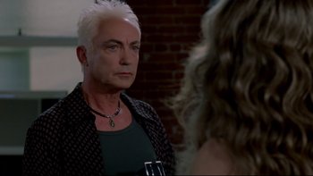 Movie still from “Surviving Christmas” (2004), directed by Mike Mitchell – A man with white hair is looking into a mirror; Close Up shot, Over the shoulder angle