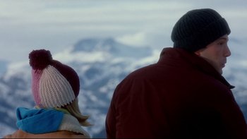 Movie still from “Surviving Christmas” (2004), directed by Mike Mitchell – A man and a woman looking out over a mountain; Medium shot, Over the shoulder angle
