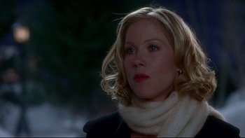 Movie still from “Surviving Christmas” (2004), directed by Mike Mitchell – A person wearing a scarf and a jacket; Close Up shot, Over the shoulder angle