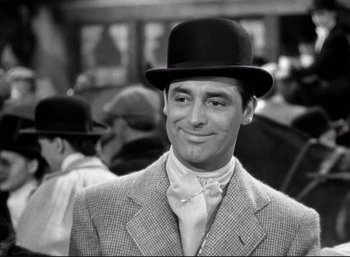 Movie still from “Suspicion” (1941), directed by Alfred Hitchcock – A black and white photo of a man wearing a top hat; Close Up shot, Over the shoulder angle