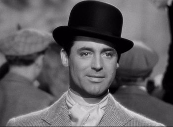 Movie still from “Suspicion” (1941), directed by Alfred Hitchcock – A black and white photo of a man wearing a top hat; Close Up shot, Low angle