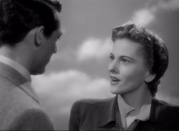 Movie still from “Suspicion” (1941), directed by Alfred Hitchcock – A man and a woman talking to each other; Close Up shot, Low angle