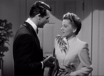 Movie still from “Suspicion” (1941), directed by Alfred Hitchcock – A man and a woman talking to each other; Medium shot, Low angle