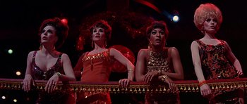Movie still from “Sweet Charity” (1969), directed by Bob Fosse – A couple of women standing next to each other on a stage; Medium shot, Low angle
