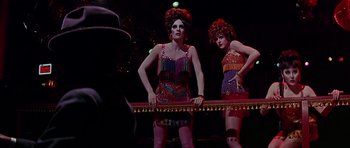 Movie still from “Sweet Charity” (1969), directed by Bob Fosse – A couple of women standing next to each other on a stage; Medium shot, Low angle