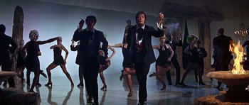 Movie still from “Sweet Charity” (1969), directed by Bob Fosse – A group of men and women dancing in a room; Medium shot, Low angle