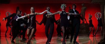 Movie still from “Sweet Charity” (1969), directed by Bob Fosse – A group of people dancing on a dance floor; Medium shot, Low angle