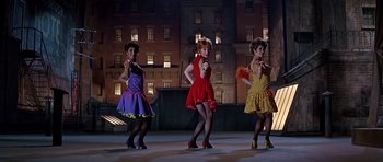 Movie still from “Sweet Charity” (1969), directed by Bob Fosse – A group of women are dancing on a stage; Wide shot, Low angle