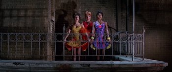 Movie still from “Sweet Charity” (1969), directed by Bob Fosse – A group of women standing next to each other on top of a railing; Medium shot, Low angle