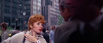 Movie still from “Sweet Charity” (1969), directed by Bob Fosse – An older man and a young woman in a city; Close Up shot, Over the shoulder angle