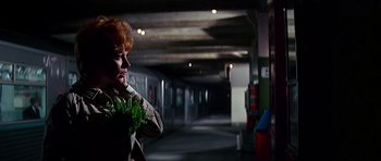 Movie still from “Sweet Charity” (1969), directed by Bob Fosse – A woman holding a bunch of greens in a subway station; Medium shot, Low angle