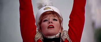 Movie still from “Sweet Charity” (1969), directed by Bob Fosse – A person wearing a uniform; Close Up shot, Low angle