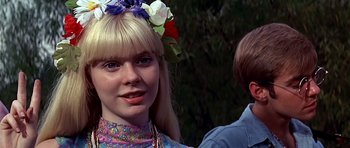 Movie still from “Sweet Charity” (1969), directed by Bob Fosse – A woman with a flower in her hair; Close Up shot, Over the shoulder angle