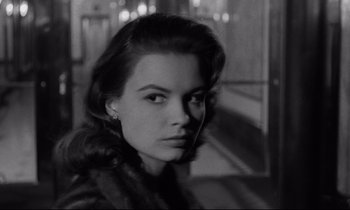 Movie still from “Sweet Smell of Success” (1957), directed by Alexander Mackendrick – A black - and - white photo of a woman in a fur coat; Close Up shot, Over the shoulder angle