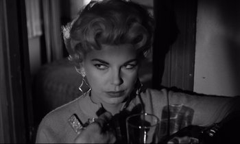 Movie still from “Sweet Smell of Success” (1957), directed by Alexander Mackendrick – An old photo of a woman holding a glass of wine; Close Up shot, Low angle