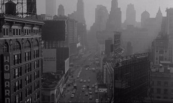 Movie still from “Sweet Smell of Success” (1957), directed by Alexander Mackendrick – A black - and - white photo of a busy city street; Extreme Wide shot, High angle