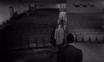 Movie still from “Sweet Smell of Success” (1957), directed by Alexander Mackendrick – A black and white photo of people walking in a theater; Extreme Wide shot, High angle