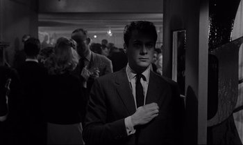 Movie still from “Sweet Smell of Success” (1957), directed by Alexander Mackendrick – A black and white photo of a man in a suit and tie; Medium shot, Low angle