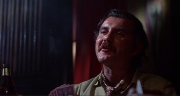 Movie still from “Sweet Sweetback's Baadasssss Song” (1971), directed by Melvin Van Peebles – A person with a mustache; Close Up shot, Low angle