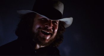 Movie still from “Sweet Sweetback's Baadasssss Song” (1971), directed by Melvin Van Peebles – A person wearing a cowboy hat; Close Up shot, Low angle